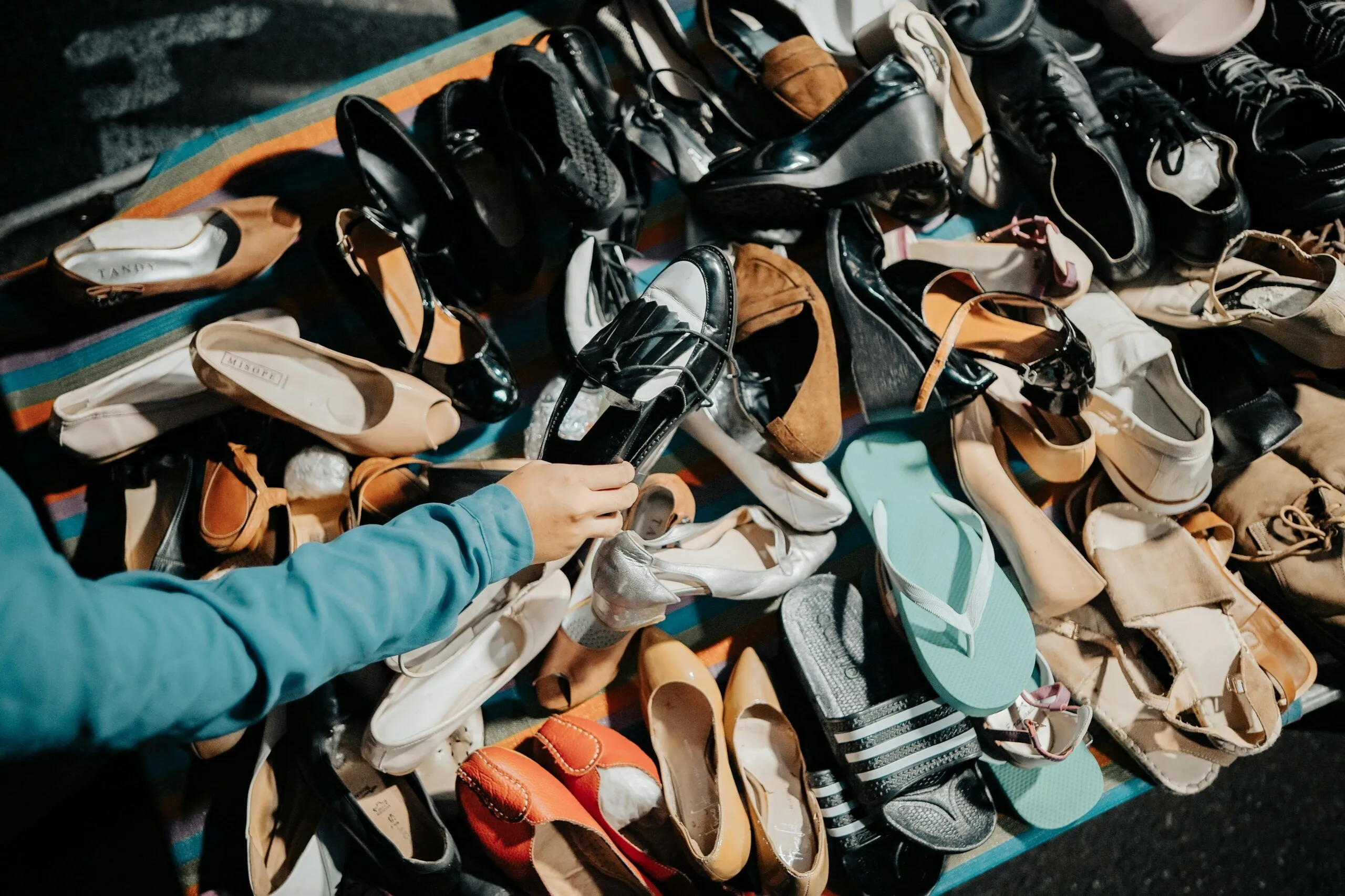 Paired used shoes sorted and packaged for wholesale resale and export.